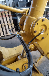 Remote Grease Line Connection on Caterpillar Grader